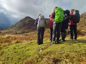 a group of hill walkers practising navigation