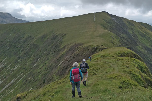walkers on a mountain ridge